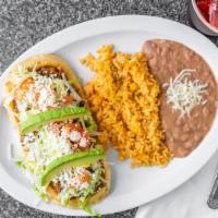 Huarache Plate · Filled with choice of meat. served with mexican rice & refried beans.