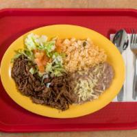 Brisket Platter · Paired with a side of rice and beans. include rice beans and one flour tortilla.