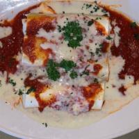 Manicotti · Crepe filled with ricotta cheese, baked and topped with tomato and cream sauce.