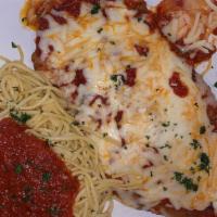 Chicken Parmigiana · Chicken breast lightly breaded topped with tomato sauce and mozzarella cheese.