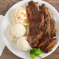 Bbq Short Ribs · Juicy Beef Short Ribs Marinated in Our House BBQ Sauce and Grilled to Perfection