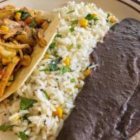 Ranchero · Vegan. Black beans, roasted potatoes, tomatoes, onions, cilantro, elote, tortilla strips in ...