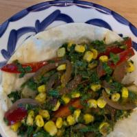 Madre Tierra (Vegan) · Vegan. Kale, sweet corn, red bell pepper, potatoes and red onions sautéed in a Uruguayan sau...