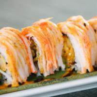 Justin Roll · Shrimp tempura, avocado, topped with crabstick, eel sauce, spicy mayo, sweet chili.