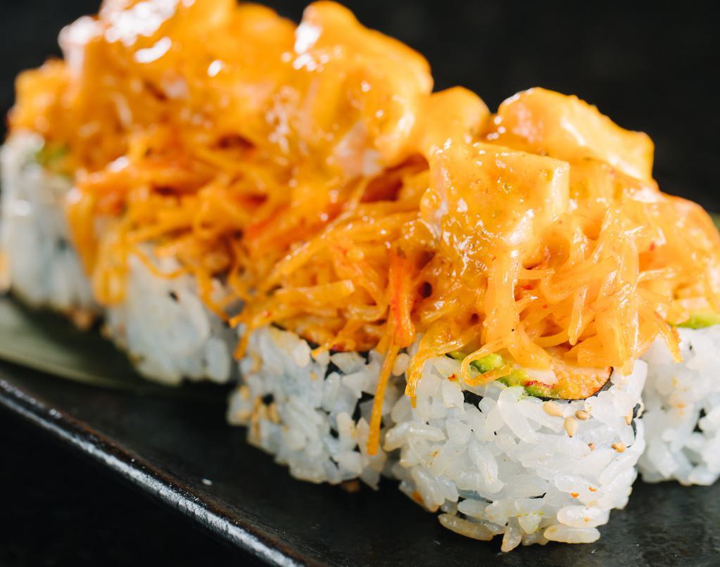 Highland Village Roll · Spicy crawfish, avocado, topped with spicy crab mix, salmon, scallions, and spicy mayo, baked.