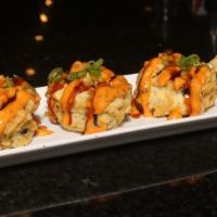 Dallas Roll · Spicy crawfish, spicy crab, avocado, cream cheese deep fried, topped with spicy mayo, eel sa...