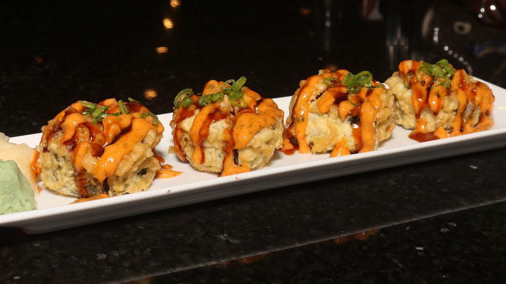 Dallas Roll · Spicy crawfish, spicy crab, avocado, cream cheese deep fried, topped with spicy mayo, eel sauce, scallion