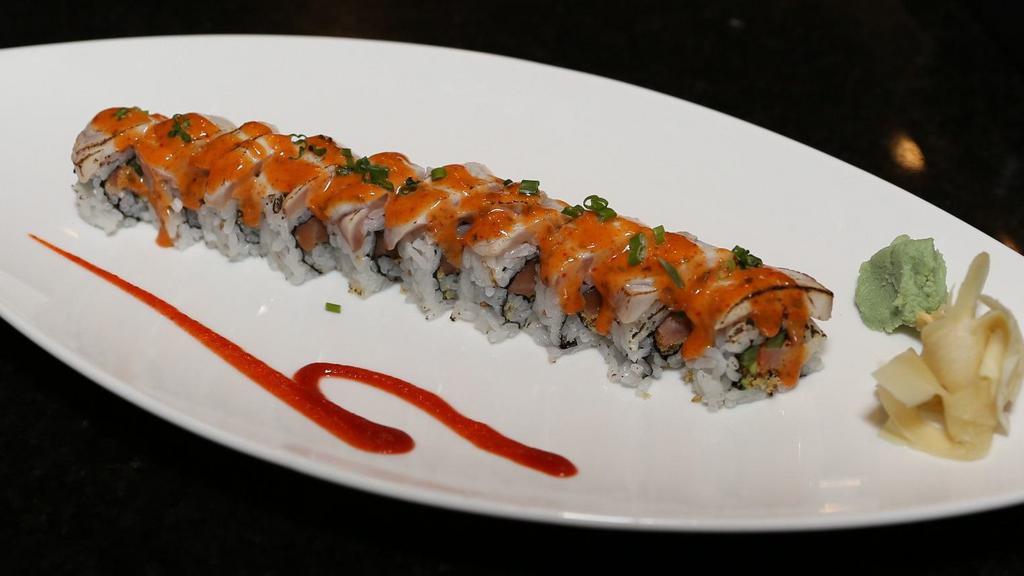 Phoenix Roll · Smoked salmon, jalapeno, tempura flake, topped with seared yellowtail, spicy mayo sauce, and scallion