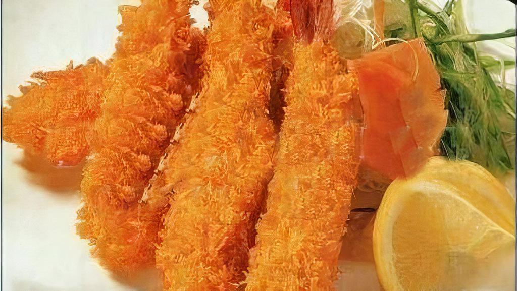 Shrimp Tempura (4) · Battered shrimp with tempura sauce.