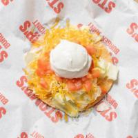 Stompada · Refried beans on a fried corn tortilla, lettuce, cheddar/ jack blend, tomato, sour cream and...