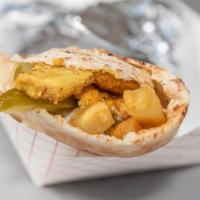 Shish Tawook Wrap · Marinated chicken, French fries, tomato, pickles, and garlic aioli.
