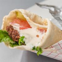 Kafta Wrap · Grilled seasoned ground beef, grilled onions, parsley, tomato, and hummus.