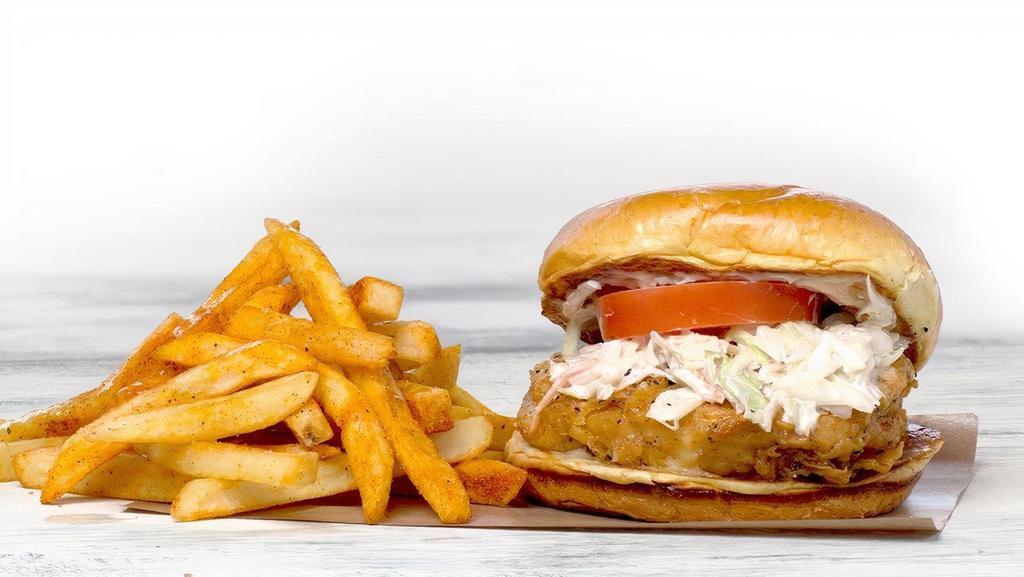 Lemon Pepper Chicken Sandwich · fried chicken breast, lemon pepper sauce, cole slaw, habanero onions, tomato, mayo and a side of fries
