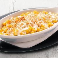 Elote Corn · hand-cut corn with sour cream, parmesan cheese, cotija cheese, valentina sauce and chili pow...