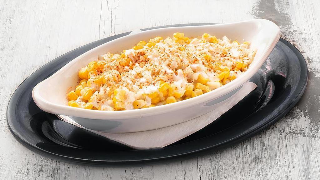 Elote Corn · hand-cut corn with sour cream, parmesan cheese, cotija cheese, valentina sauce and chili powder .