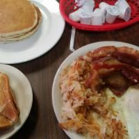 Mom'S Big Breakfast · 2 eggs, served with bacon, sausage patty and ham, choice of potatoes, grits or fries and cho...