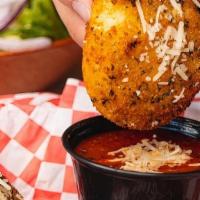 --Fried Cheese Raviolis · Six breaded cheese raviolis fried until golden brown, topped with fresh parmesan and served ...