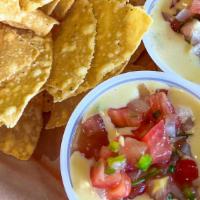 --Chips & Queso · Homemade queso served with tortilla chips.