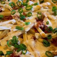 --Cheese Fries · Ranch seasoned fries with our house made queso and ranch drizzle, topped with bacon and gree...