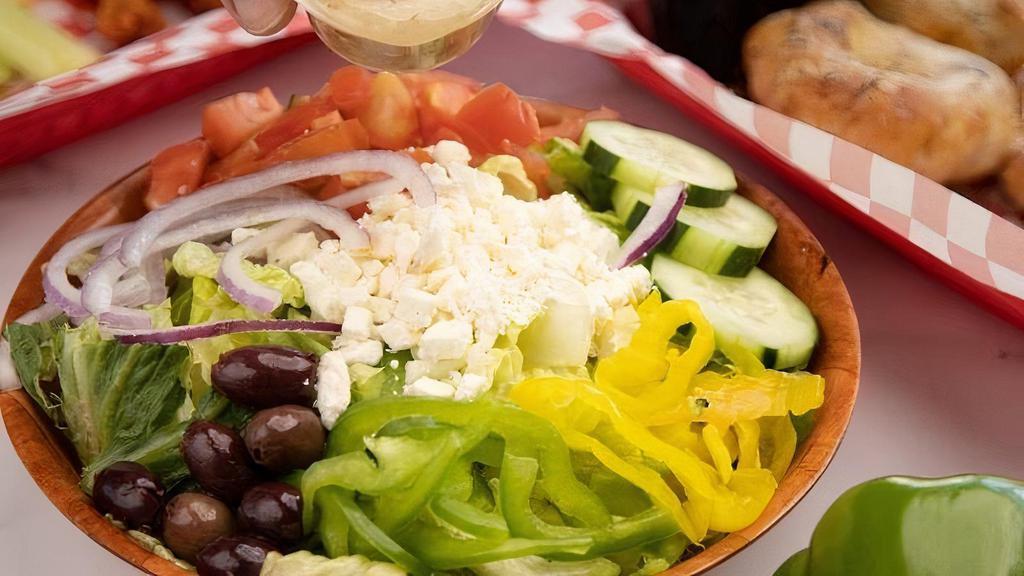 --Sm Greek Salad · Greek Kalamata olives, Roma tomatoes, red onions, bell peppers, banana peppers, cucumbers and feta cheese on romaine lettuce, served with Greek dressing.