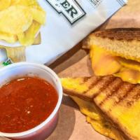 --Adult Grilled Cheese · Buttery thick cut Texas toast with American, gouda, muenster and cheddar cheese. Served with...