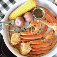 Snow Crab Legs (1 Lb) · Served with corn and new potatoes.