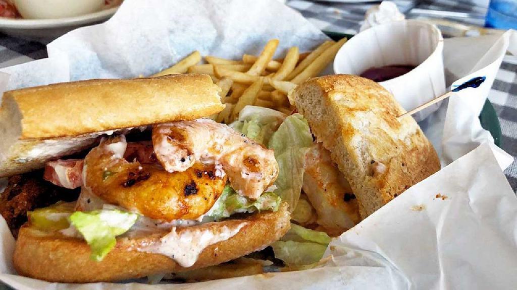 Bbq Shrimp Poor Boy · All Po Boy Loafs served on Cuban bread dressed with cocktail and tartar sauce and layered with lettuce, tomatoes, onion, and pickles and served with fries and hushpuppies.