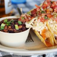 Grilled Tilapia Tacos · 3 crispy corn tortillas stuffed with  grilled tilapia, pico de gallo, cole claw, and comebac...