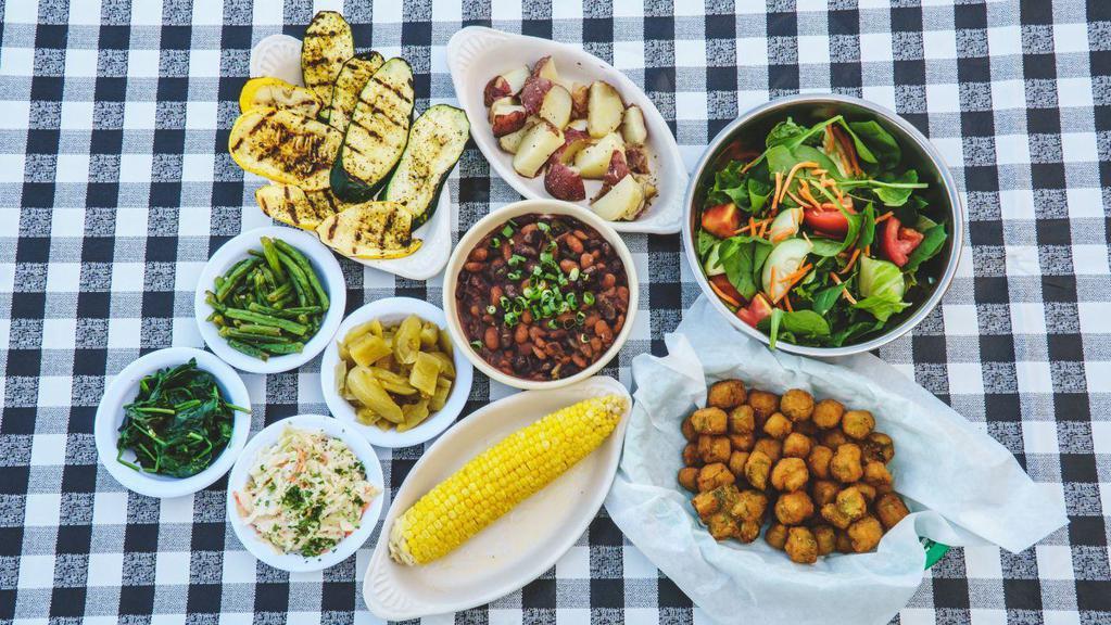 2 Veggies & Salad · Choice of barracho beans and rice, pickled green tomatoes, grilled squash and zucchini, corn on the cob, new potatoes, green beans, side salad, fried okra, cole slaw or spinach.