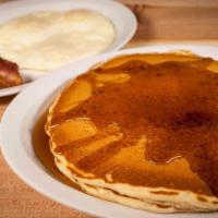 Country Boy Breakfast · Two of our fluffy pancakes served with three eggs and your choice of bacon, sausage, or ham.