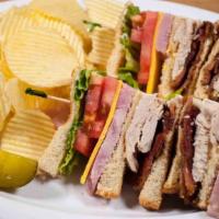 Club Sandwich · Triple decker with ham, turkey, bacon, cheese, lettuce, tomato, and mayonnaise. Served with ...