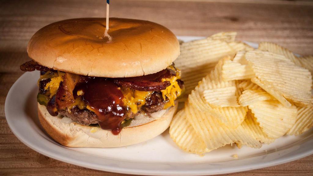 Bbq Bacon Cheddar Burger · Topped with Crispy Bacon, Cheddar Cheese, BBQ sauce, Onions, and Pickles. Served with Chips.
