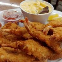 Fried Shrimp Dinner · Hand breaded daily. Served with french fries or mashed potatoes, salad, one roll and one cor...