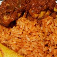 Jollof Rice W Chicken And Fried Plantains · A West African mainstay, also called Benachin is a flavorful tasty rice, simmered in spicy s...