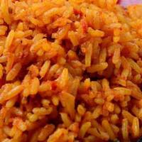 Jollof Rice 24Oz · A West African mainstay, also called Benachin is a flavorful tasty rice, simmered in spicy s...