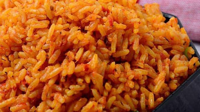 Jollof Rice 24Oz · A West African mainstay, also called Benachin is a flavorful tasty rice, simmered in spicy savory deep fried tomato stew.