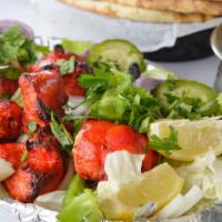 Chicken Tikka · Tender boneless pieces of chicken breast flavored with spices and grilled to perfection in t...