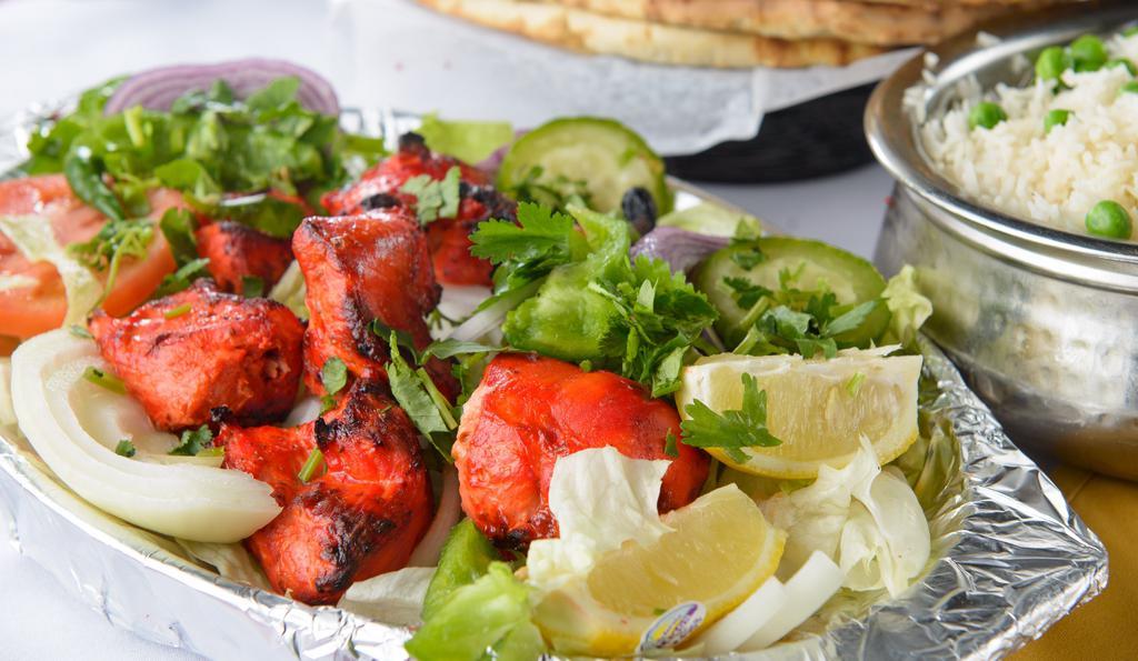 Chicken Tikka · Tender boneless pieces of chicken breast flavored with spices and grilled to perfection in the Tandoor.