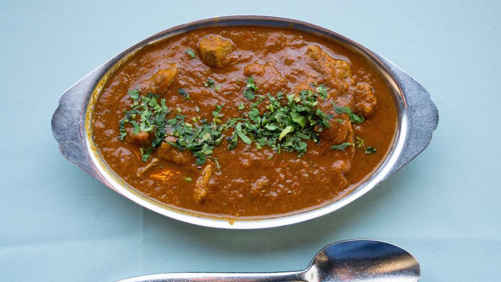 Lamb-Curry · A traditional dish cooked with boneless lamb, onion, garlic, ginger, tomatoes and curry spices.