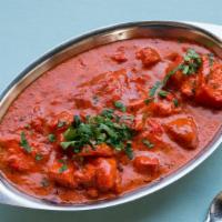#256 Chicken Tikka Masala · Tandoori chicken cubes simmered in a fresh tomato sauce.