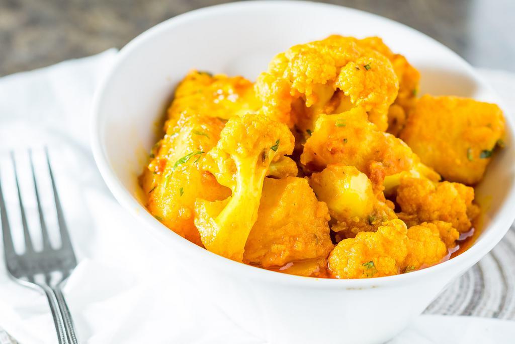 Aloo Gobi · Fresh cauliflower and potatoes cooked with herbs and spices.