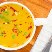 Turka Daal · Yellow split lentils cooked to a thick soup with herbs and spices.