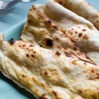 Palace Naan · Contains almonds, dry fruit.. Leavened bread with nuts and raisins.