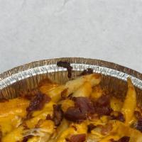 Cheddar Bacon Fries · Crisp thick French fries topped with fresh shredded Cheddar cheese and real bacon crumbles p...