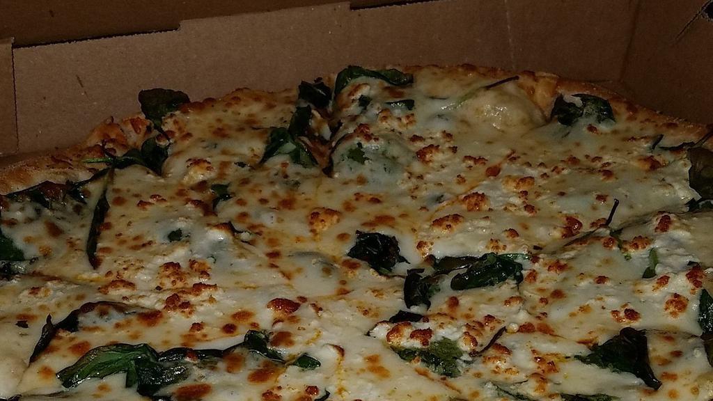 Caprina Pizza · Extra virgin olive oil, spinach, garlic, mozzarella and feta.