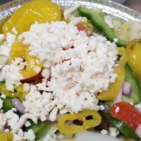 Greek Salad · Kalamata and green olives, feta, Greek pepper, tomato, onion, bell pepper and cheese.