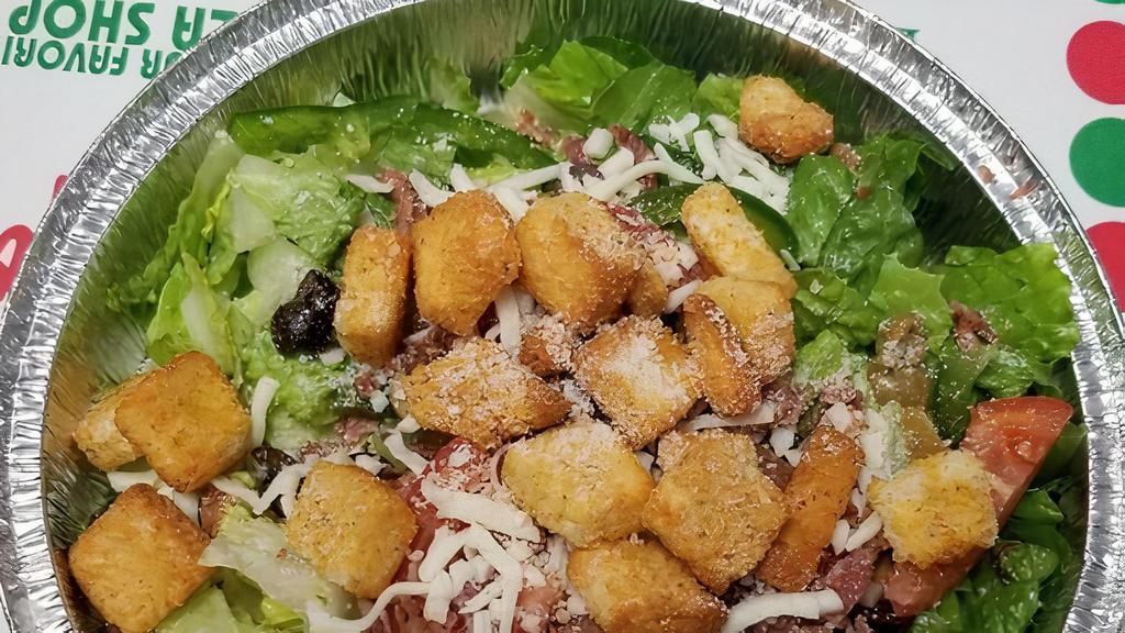 Dan'S House Caesar Salad · Romaine, olives, tomato, onion, bell pepper, bacon, cheese and croutons.