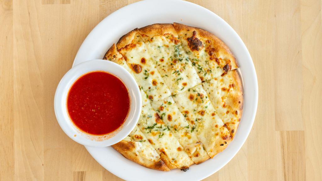 Cheesey Garlic Bread · Served with two marinara or ranch.