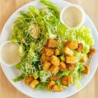 Caesar Side Salad · Green salad with caesar dressing and cheese.