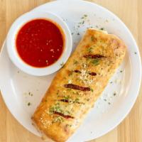 Stromboli · Pepperoni, sliced Italian sausage, Canadian bacon, and mozzarella. Served with two ranches o...
